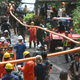 A water pipe being placed at the entrance to a cave complex where 12 boys and their soccer coach were trapped inside when heavy rains flooded the cave in northern Thailand.